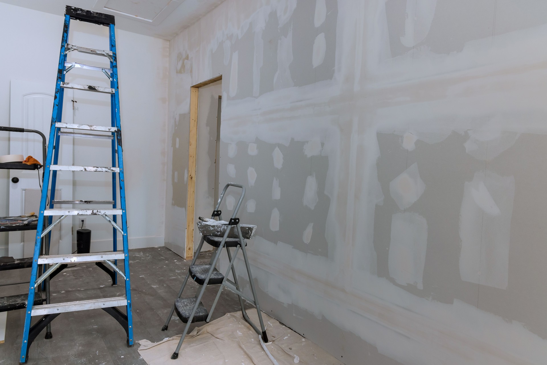 Plastering drywall is complete a ready for painting in new house that is under construction